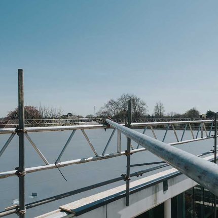 Professional residential scaffolding erected for a safe and flawless flat roof solar panel installation in London.