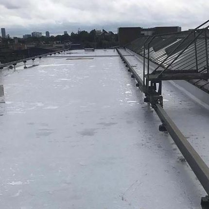 Secure commercial edge protection and safety railings installed alongside a high-performance flat roof system by our certified london roofing specialists.