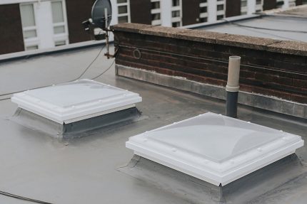 Energy-efficient warm roof insulation build-up installed during a St. John's Wood flat roof refurbishment.