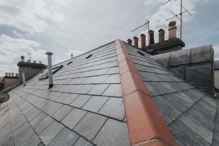 Single-ply flat roof system and modern insulation installed to current UK building regulations.