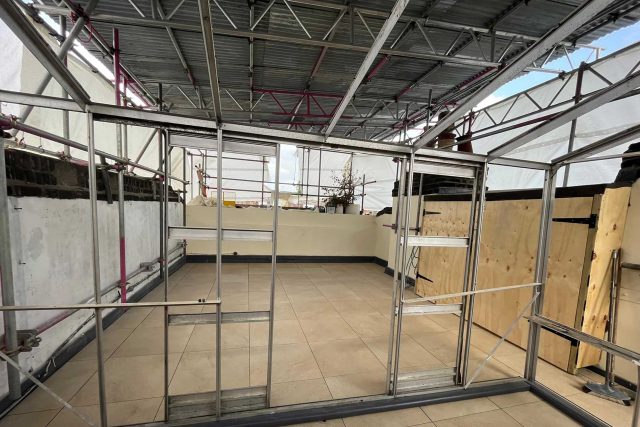 London Kensington flat roof terrace conversion repair Sika Saranfil, preserve existing greenhouse replacing roof builders company near me.