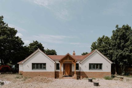 Close-up of traditional clay roof tiles installed for efficient water drainage on a Surrey property.