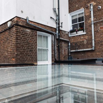 Precision engineered flat roof glazing forming a robust waterproofing system by our specialist flat roofer london team.
