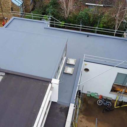 Full perimeter scaffolding and 130mm Enertherm warm roof insulation installation on a London commercial building.