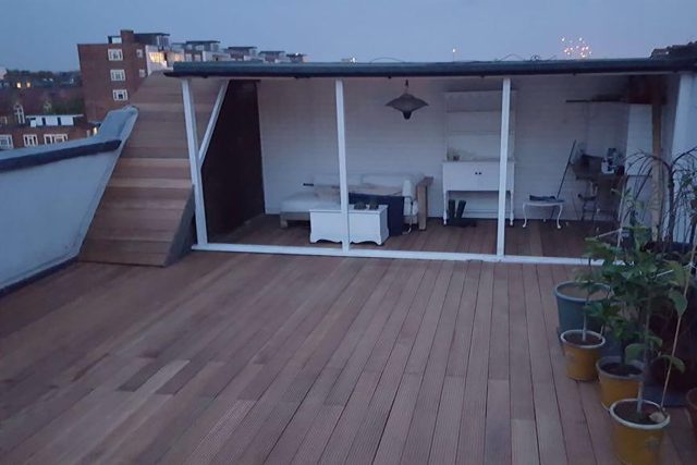 Flat roofing refurbishment services using Sika Sarnafil, roof terrace wood decking Kensington London a specialist roof building company.