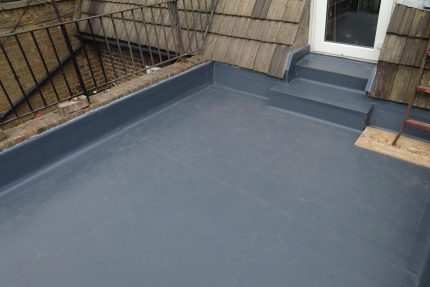 Completed flat roof replacement prepared for the installation of new roof terrace decking.