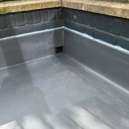 Single-ply flat roof membrane, lead flashings, and skylight kerbs installed by our Ealing flat roofer.