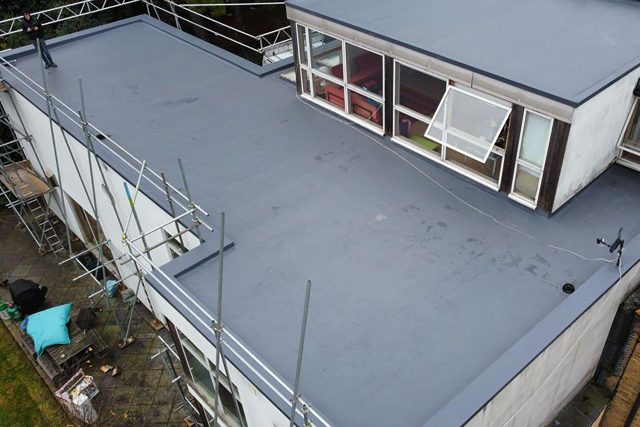 Flat Roofer for commercial property building in London Chiswick replacement damaged felt roof with Sika Sarnafil, Garland, IKO Armourplan.