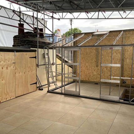 London Kensington flat roof terrace conversion repair Sika Saranfil, preserve existing greenhouse replacing roof builders company near me.