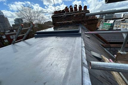 Professional scaffolding erected for safe flat roof installation on a multi-story property in Hampstead.
