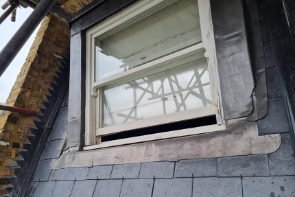 Professional roofing contractors installing a seamless, watertight Sika Sarnafil membrane on a Holland Park flat roof.