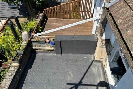 Flat roof specialist roofers and builders in Oxshott Surrey, installations of the Garland, Sika felt roof system, roofing repair services.