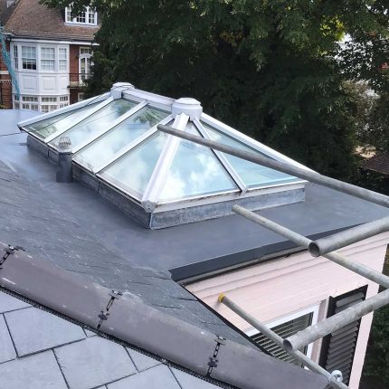 Commercial-grade dry fix ridge and roof lantern integration, demonstrating the meticulous technical precision of our flat roofer london experts.