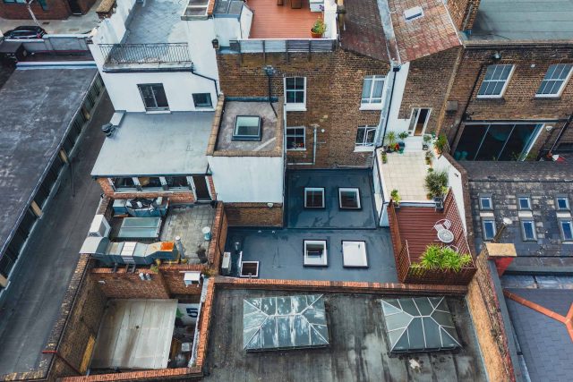 Roofer Notting Hill London electric Velux skylights installers into single ply flat felt roof, services include roofing repairs, lead work.