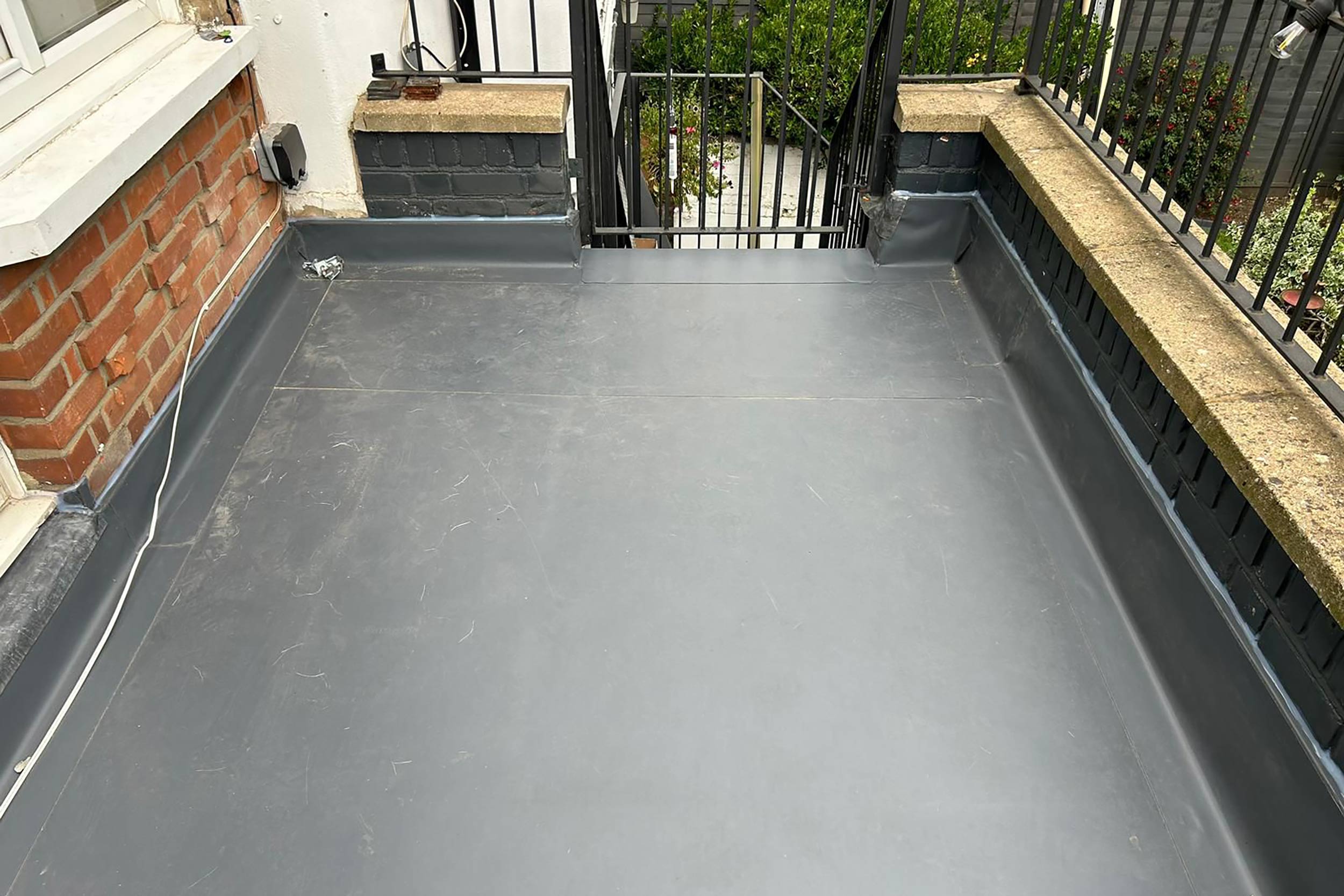 Single Ply IKO Polymeric Flat Roof Richmond Surrey Greater London Roofer near me London Refurbishment Building Regulation