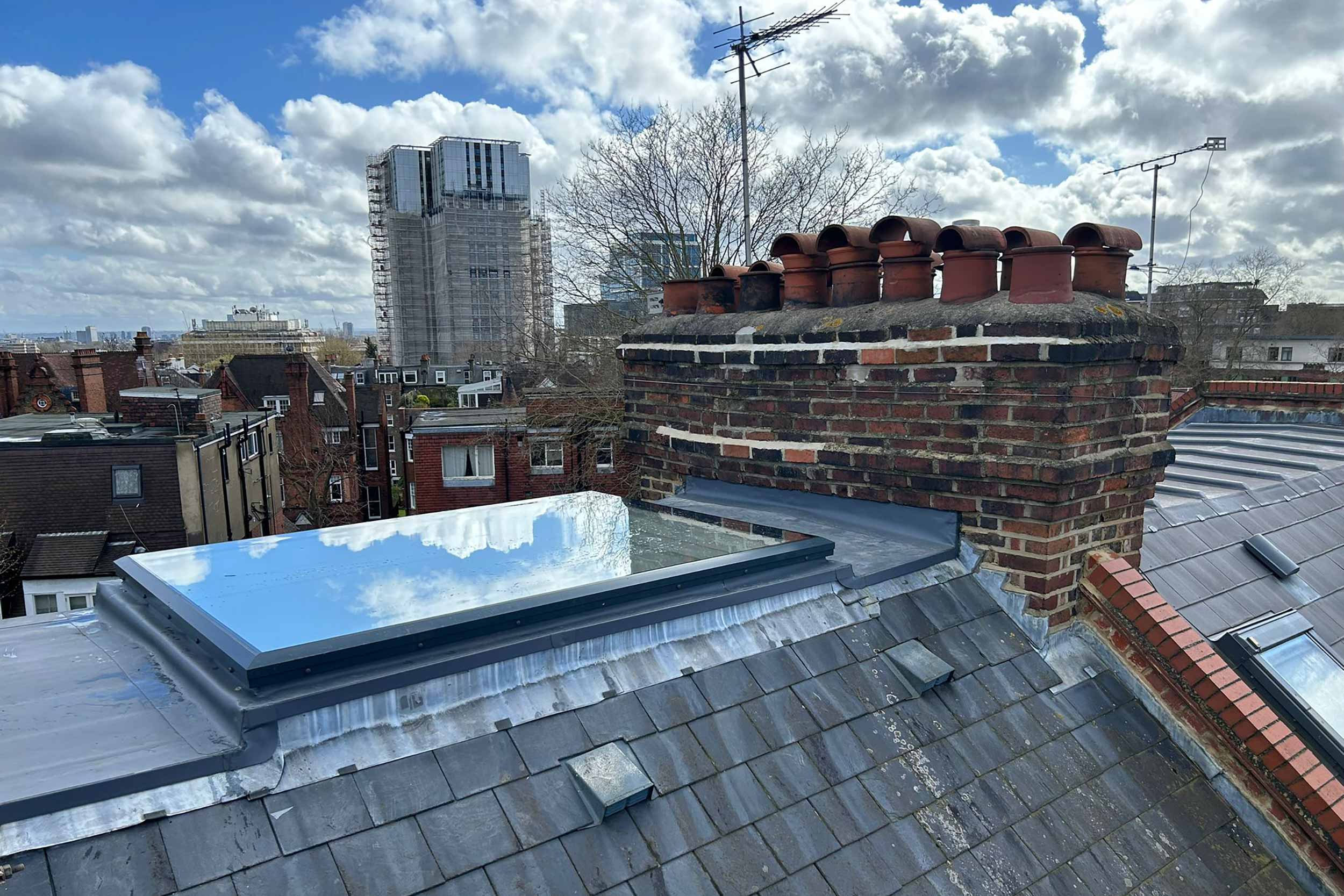 Flat Roof specialist Hampstead North London, new flat roof installers services, repairs system, skylight and chimney repairs, scaffolding.