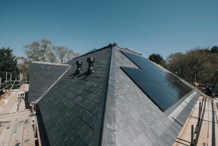 Close-up of professionally installed slate roofing tiles designed to provide durability and weather resistance.