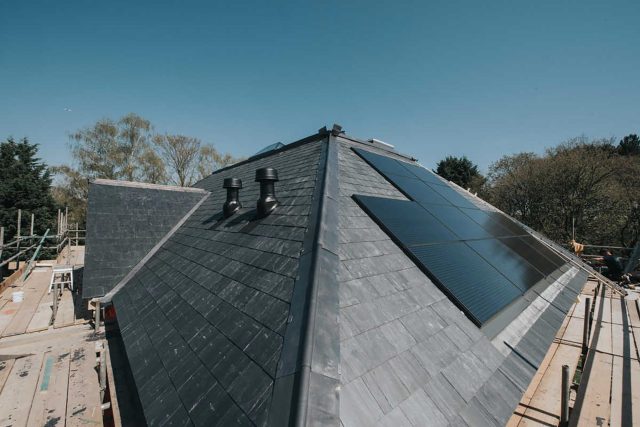 Solar panels mounted on a pitched residential roof