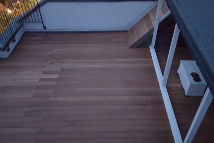 Stylish and functional roof terrace created with custom hardwood decking over a flat roof in London.