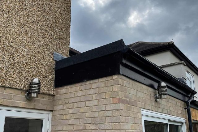 Professional flat roof replacement and repair services underway on a residential property in Raynes Park.
