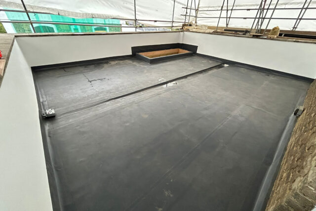 Professional flat roof replacement and installation underway on a residential property in Westminster.