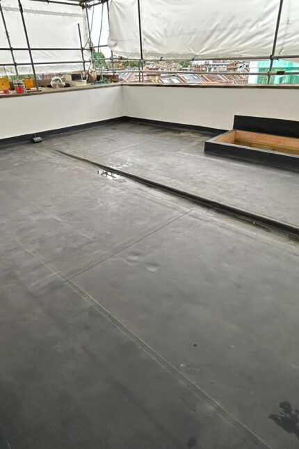 Weather-sealed rooftop water tank housing and EPDM flat roof membrane completed by our flat roofer in Mayfair W1.
