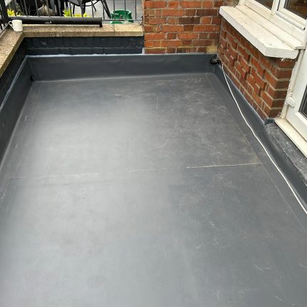 Expert Queen's Park roofers installing a durable, high-performance single-ply flat roof system.