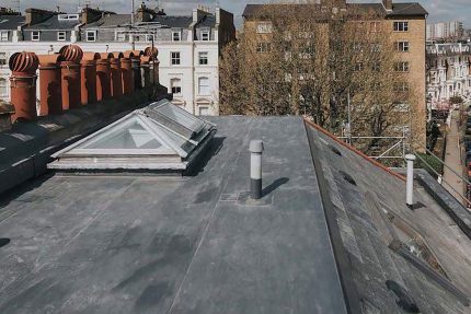 Fully approved installers applying a durable Sika Sarnafil single-ply flat roof system.