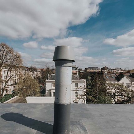 A completed flat roof replacement with edge detailing on a home in Barnes, London.