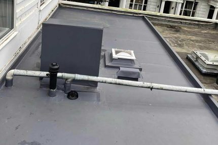 Finished Sika Sarnafil single-ply flat roof installation on a home in Putney, South West London.