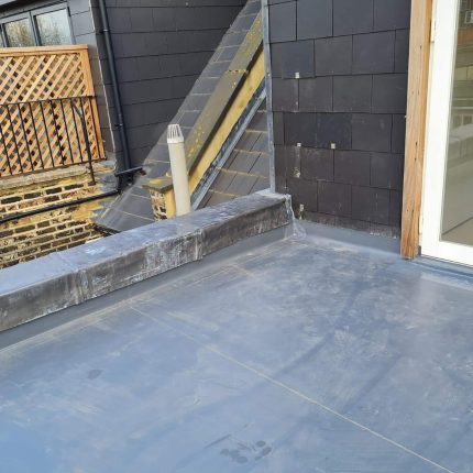 Standing seam roofline and slate roof replacement executed by our local roofing specialists in Chelsea.