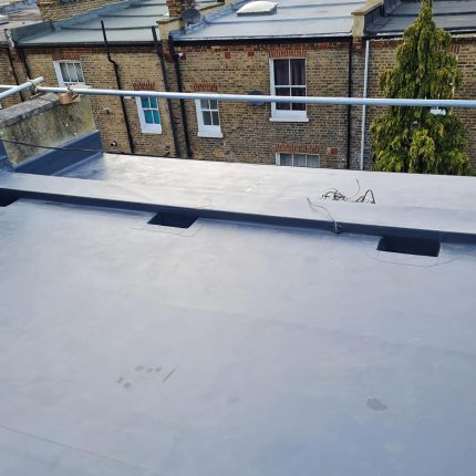 High-performance GRP flat roof membrane securely installed on a commercial Chelsea property by our premier roofer London specialists.