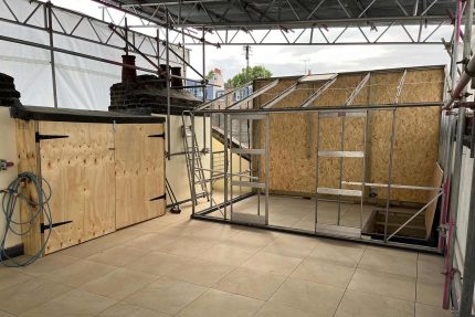 Fully approved installers applying a durable Sika Sarnafil single-ply flat roof system in Kensington, London.