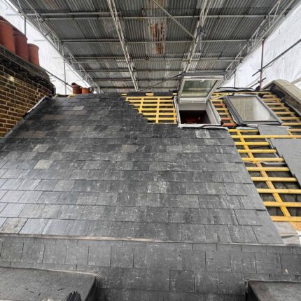 Heritage slate restoration, lead valleys, and chimney repairs executed by our Notting Hill roofer.