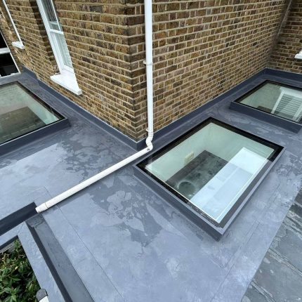 Single-ply flat roof system upgraded with premium solar energy panels to enhance domestic property value in London.