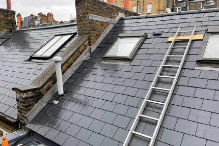 Newly constructed wooden decking on a residential roof terrace in Chelsea.