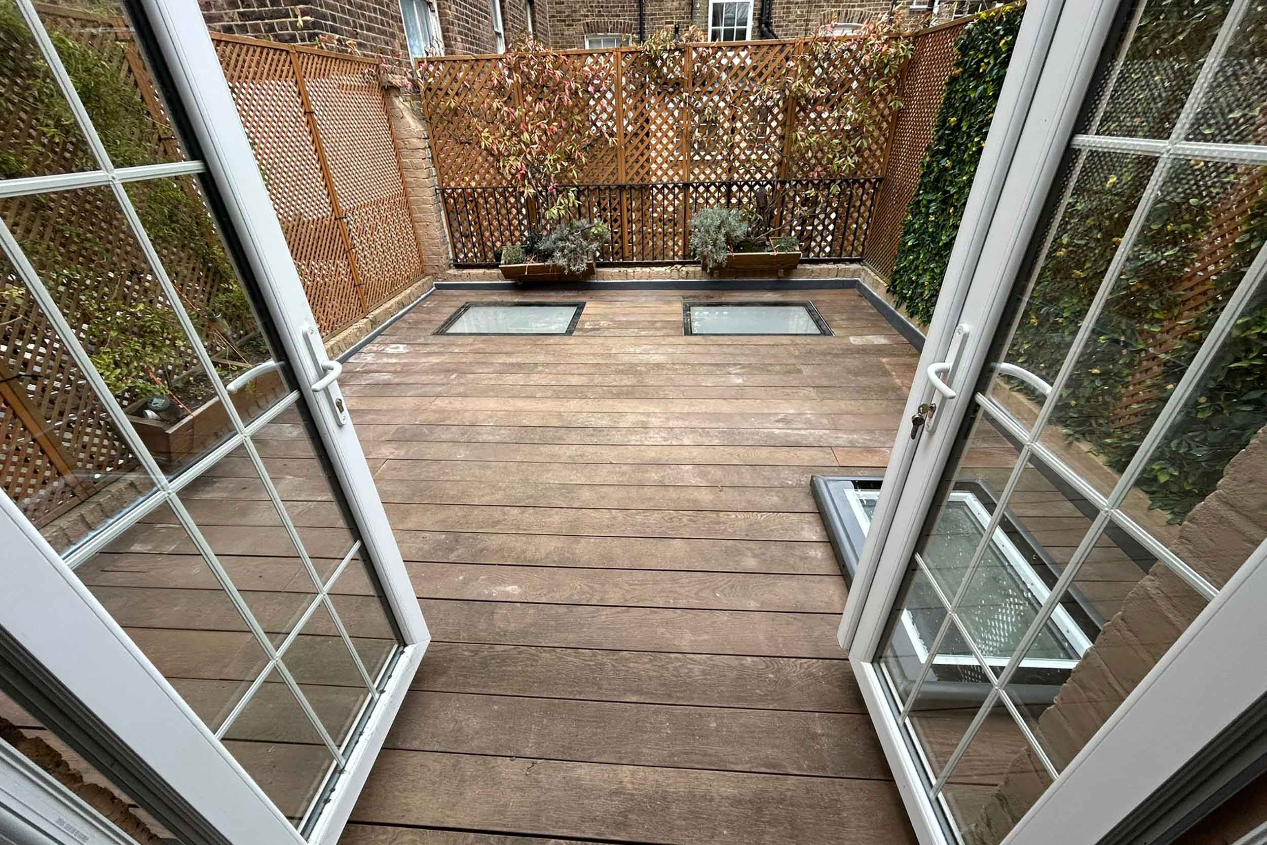 Roofer Weybridge Surrey flat roofing services specialist roofing company repairs near me no 1 company near me roofer terrace decking.