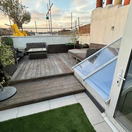 Bespoke flat roof terrace design showcasing premium decking materials and meticulous construction by leading london roofing experts.