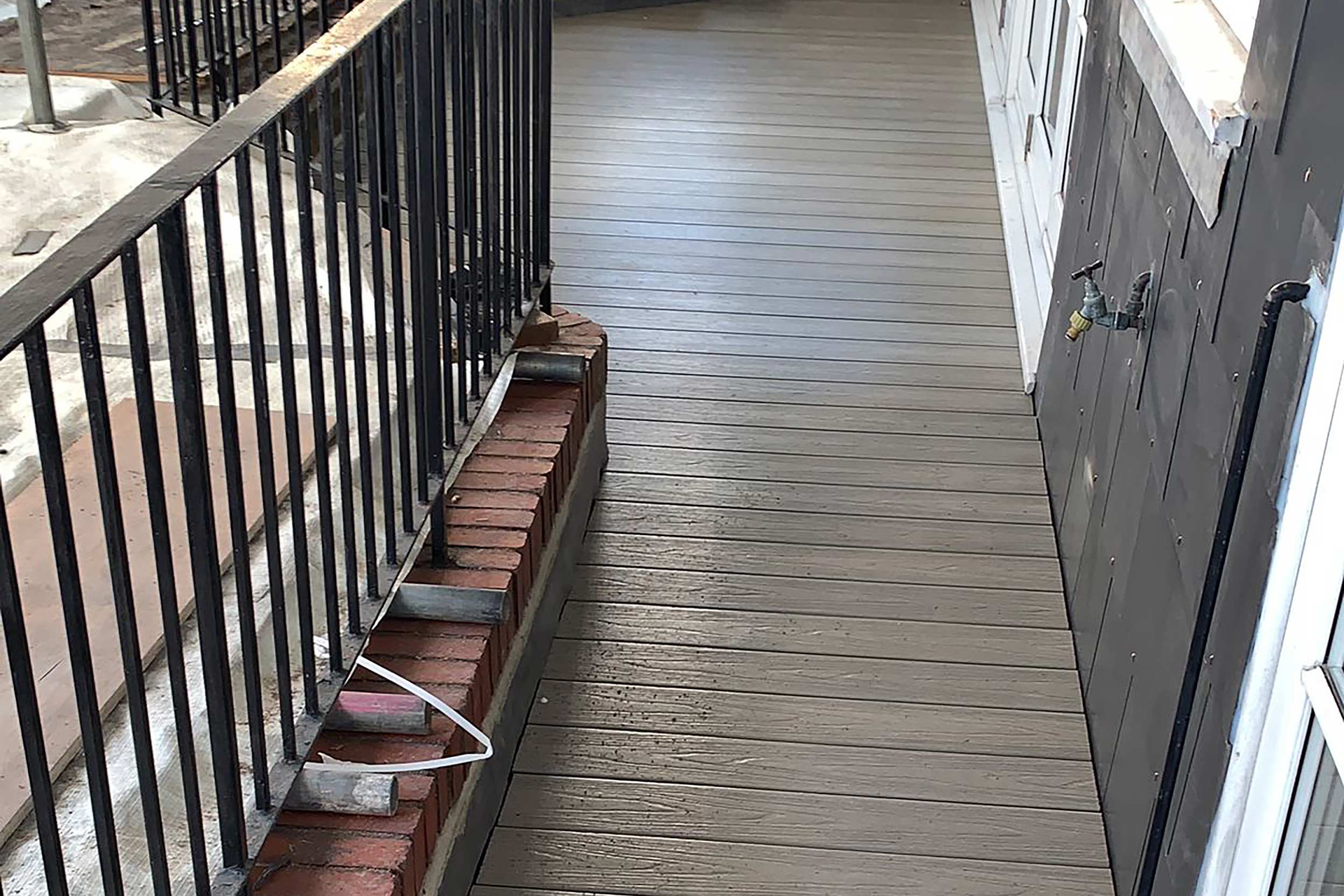 Roofer West Hampstead London flat felt roof repairs builder designer composite decking contractor building regulations terrace company
