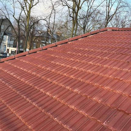 Heritage pitched roofing upgrade in Highgate North London, illustrating premium terracotta clay tiles and expert thermal insulation integration.