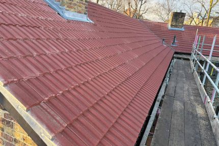 Completed traditional pitched roof with red concrete tiles restoring a Highgate property.