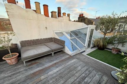 Applying a state-of-the-art single-ply roofing system for a watertight balcony seal.