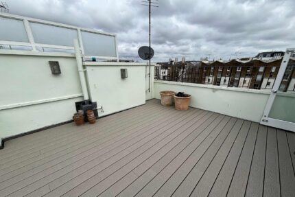 Applying a durable Garland felt system beneath stylish new millboard decking.