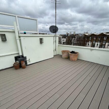High-capacity commercial roof terrace featuring durable grey decking and flawless edge detailing, completed by a trusted roofer london specialist.