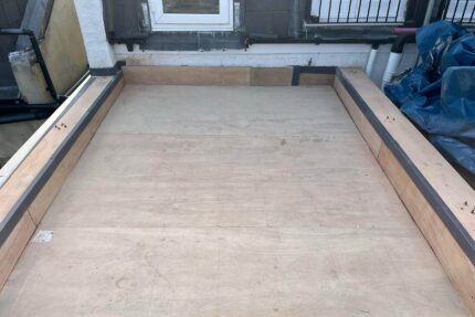Sleek glass perimeter panels providing secure, unobstructed views from a Battersea roof terrace.