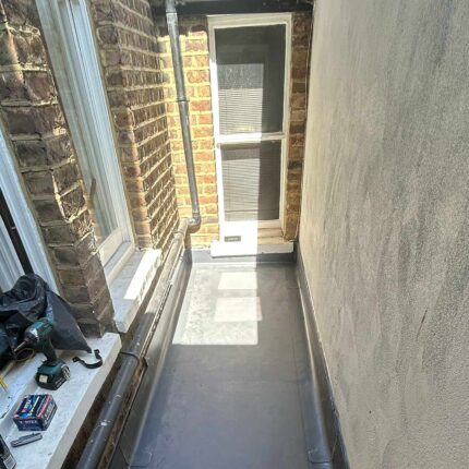 Pristine single-ply flat roof membrane meticulously installed for a domestic client by our highly experienced flat roofer london professionals.