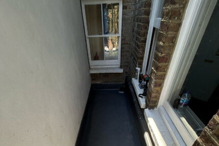 Seamless installation of a weather-resistant and durable IKO single ply flat roof.