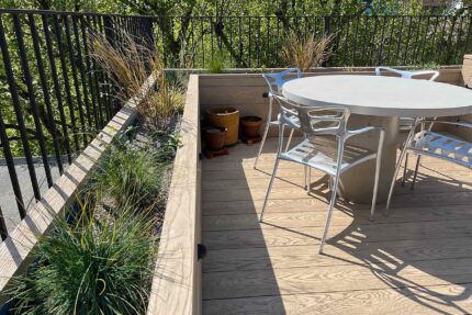 Flat roof replacement using high-performance Debotec Laser Gold Mineral Felt for waterproofing.