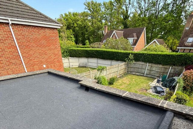 Residential flat roof replacement project underway on a property in Putney, London.