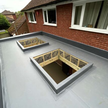 High-performance Celotex insulation tightly fitted beneath a pristine flat roof surface by our specialist roofer london installers, elevating the thermal efficiency of the property.
